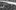 An old monochrome illustration shows buildings by a river