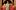 Three actors stand laughing and holding candles and knives