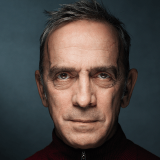 An actor looking into the camera.